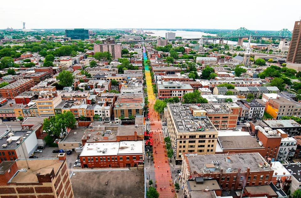 A 1-kilometer-long rainbow suspended over a street in Montreal